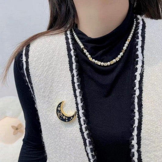 18K CC 25K Black Moon Brooch