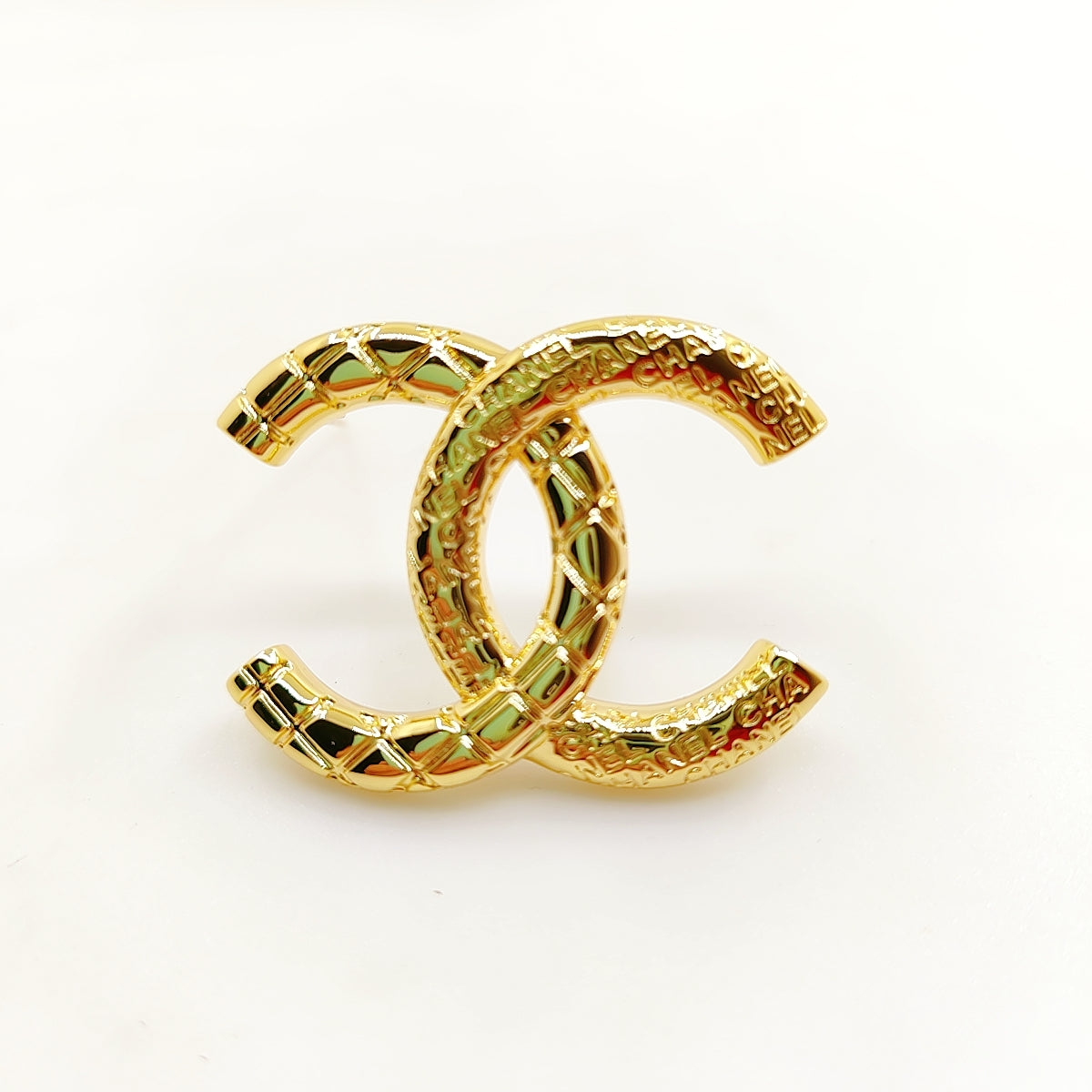 18K CC 24S Brooch
