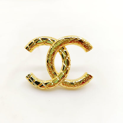 18K CC 24S Brooch