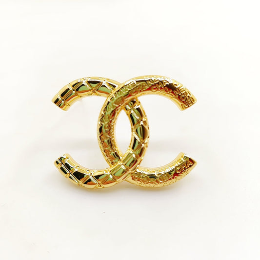 18K CC 24S Brooch