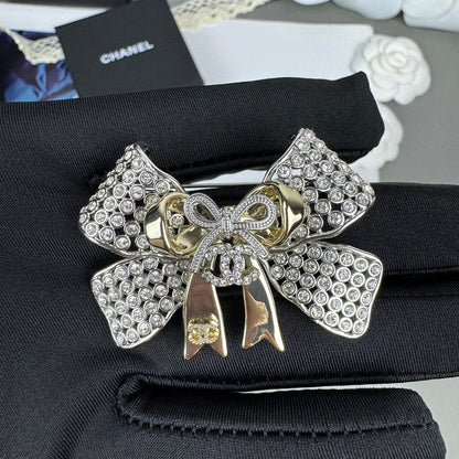 18K CC 25K Bow Tie Diamond Brooch