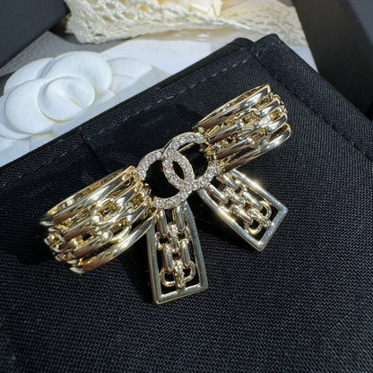 18K CC 25K Bow Tie Diamond Gold Brooch