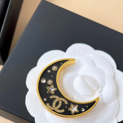 18K CC 25K Black Moon Brooch