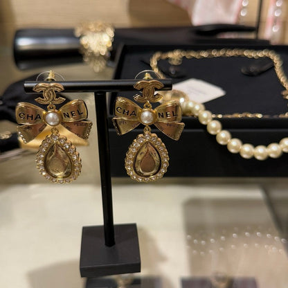 18K CC 25K Golden Bow Earrings